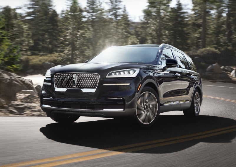 A Lincoln Aviator® SUV is being driven on a winding mountain road | Oliver Lincoln in Plymouth IN