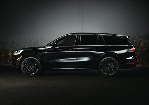 A 2024 Lincoln Aviator® SUV is shown in the Infinite Black exterior color | Oliver Lincoln in Plymouth IN