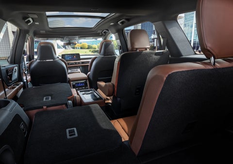 The interior of the 2025 Lincoln Aviator® SUV is shown with two seats folded down for added space. | Oliver Lincoln in Plymouth IN