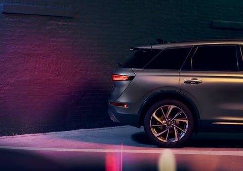 A dramatization of a 2025 Lincoln Corsair® SUV is shown backing up toward a wall. | Oliver Lincoln in Plymouth IN