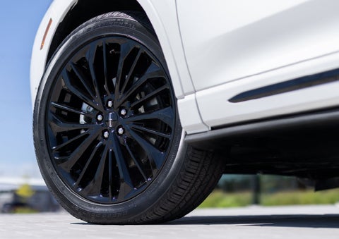 A stylish 20-inch black aluminum wheel of the available Jet Appearance Package is shown. | Oliver Lincoln in Plymouth IN