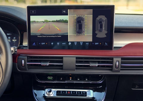 The driver of a 2024 Lincoln Corsair® SUV is shown selecting the drive mode. | Oliver Lincoln in Plymouth IN