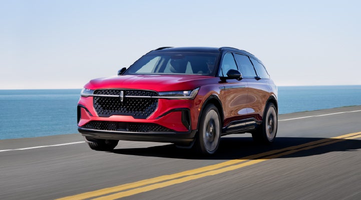 A 2025 Lincoln Nautilus® SUV is being driven on a seaside roadway. | Oliver Lincoln in Plymouth IN