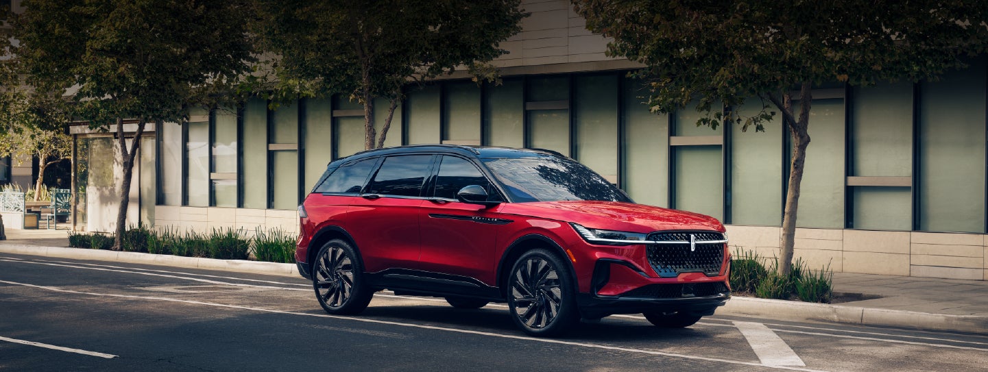 A 2025 Lincoln Nautilus® SUV with an available hybrid powertrain is parked in an urban setting. | Oliver Lincoln in Plymouth IN