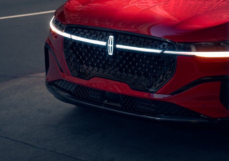 The available front LED light bar and center Lincoln Star logo glow at dusk. | Oliver Lincoln in Plymouth IN