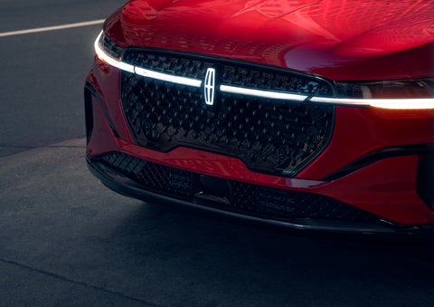 The available front LED light bar and center Lincoln Star logo glow at dusk. | Oliver Lincoln in Plymouth IN