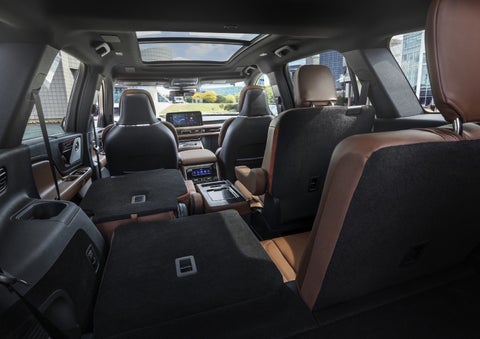 One side of the PowerFold® third-row seat and a second-row seat are folded forward in the 2026 Lincoln Aviator® SUV. | Oliver Lincoln in Plymouth IN