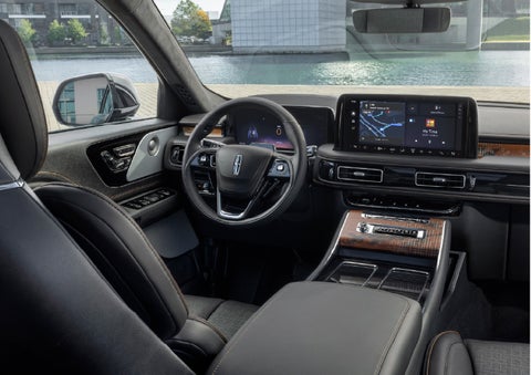 The interior of the 2026 Lincoln Aviator® SUV is shown parked with a view of a harbor through the windshield. | Oliver Lincoln in Plymouth IN
