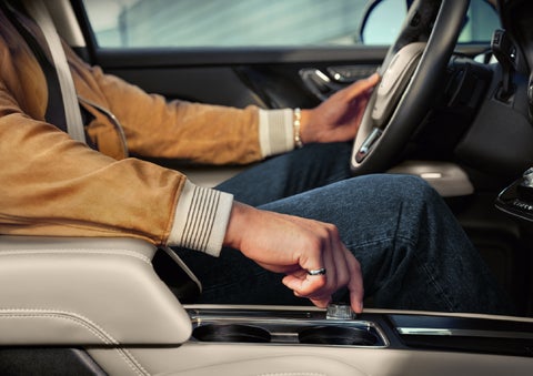 The driver of a 2026 Lincoln Corsair® SUV is shown selecting a drive mode. | Oliver Lincoln in Plymouth IN