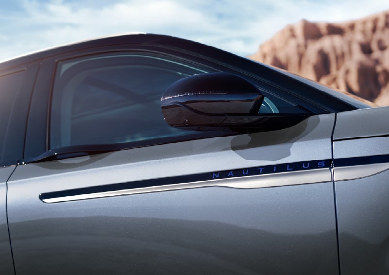 Blue lettering on the side of the vehicle that reads Nautilus indicates the available Hybrid Powertrain. | Oliver Lincoln in Plymouth IN