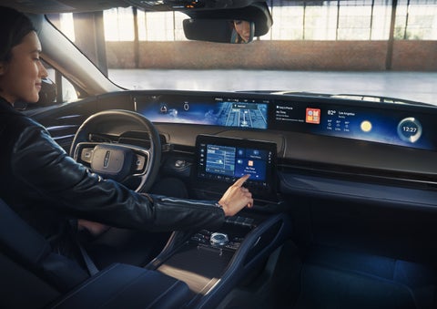 The driver of a 2026 Lincoln Nautilus® SUV interacts with the center touchscreen. | Oliver Lincoln in Plymouth IN