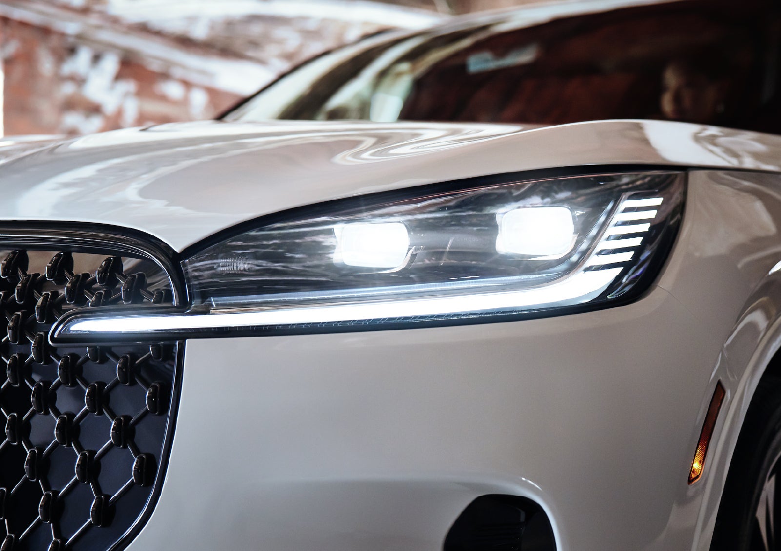 A close-up of a headlamp on the 2027 Lincoln Aviator® SUV is shown. | Oliver Lincoln in Plymouth IN