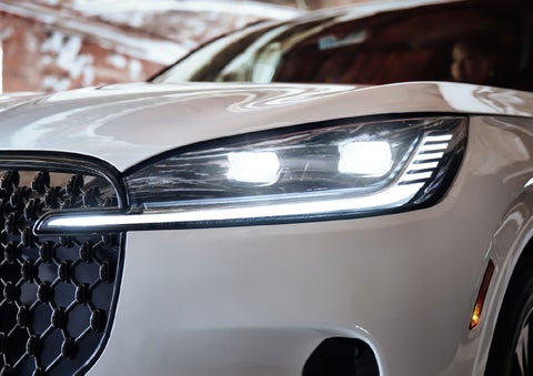 A close-up of a headlamp on the 2027 Lincoln Aviator® SUV is shown. | Oliver Lincoln in Plymouth IN